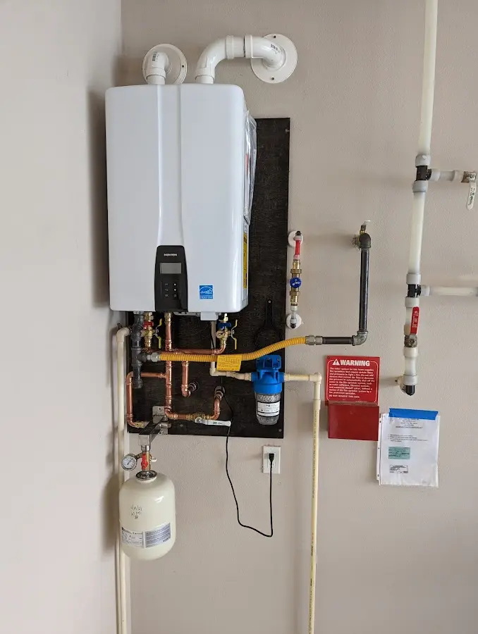 Professional plumber installing copper piping in a Big Bear Lake home